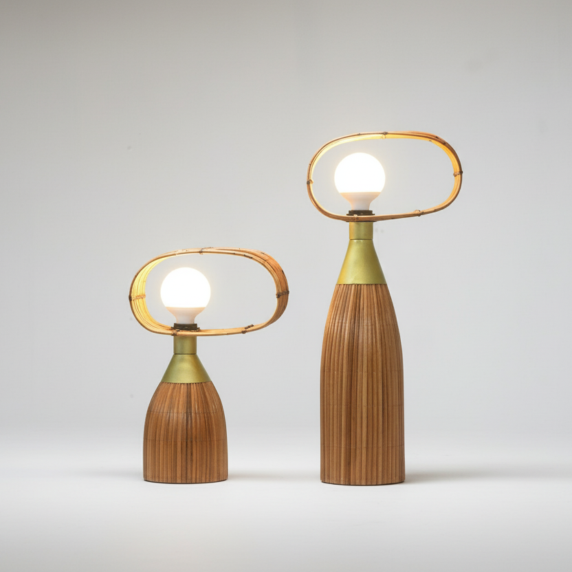 Two modern table lamps with wooden bases and metal loops on a wooden surface against a gray background.