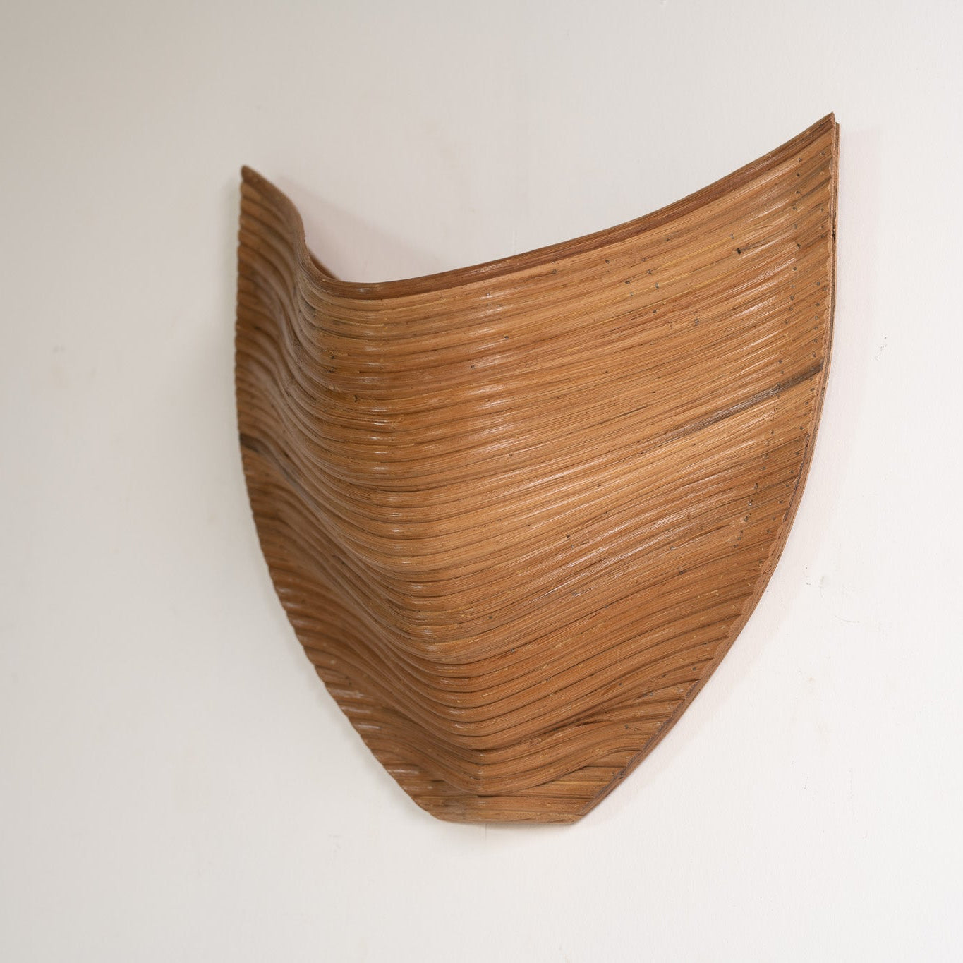Aurora Rattan Core Wall Sconce — shield shape detail, handwoven rattan texture
