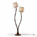 Calyx Rattan Floor Lamp — handcrafted rattan shade, warm ambient light, USA