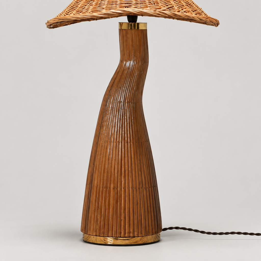  “Close-up of Shroom’s curved, vertically ribbed base with gold-colored trim and a dark power cord.”