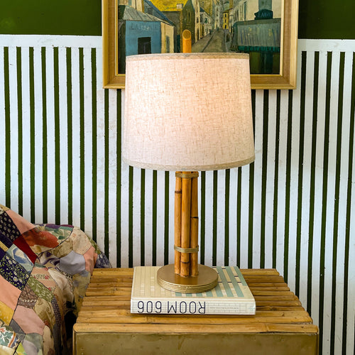 "Rattan & Brass table lamp, full profile, slender rattan form with gold hardware, studio white — Rattanology"