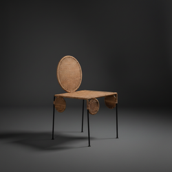 Rattan chair with dark grey studio background