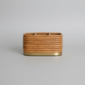 Rattan desk organizer on grey background