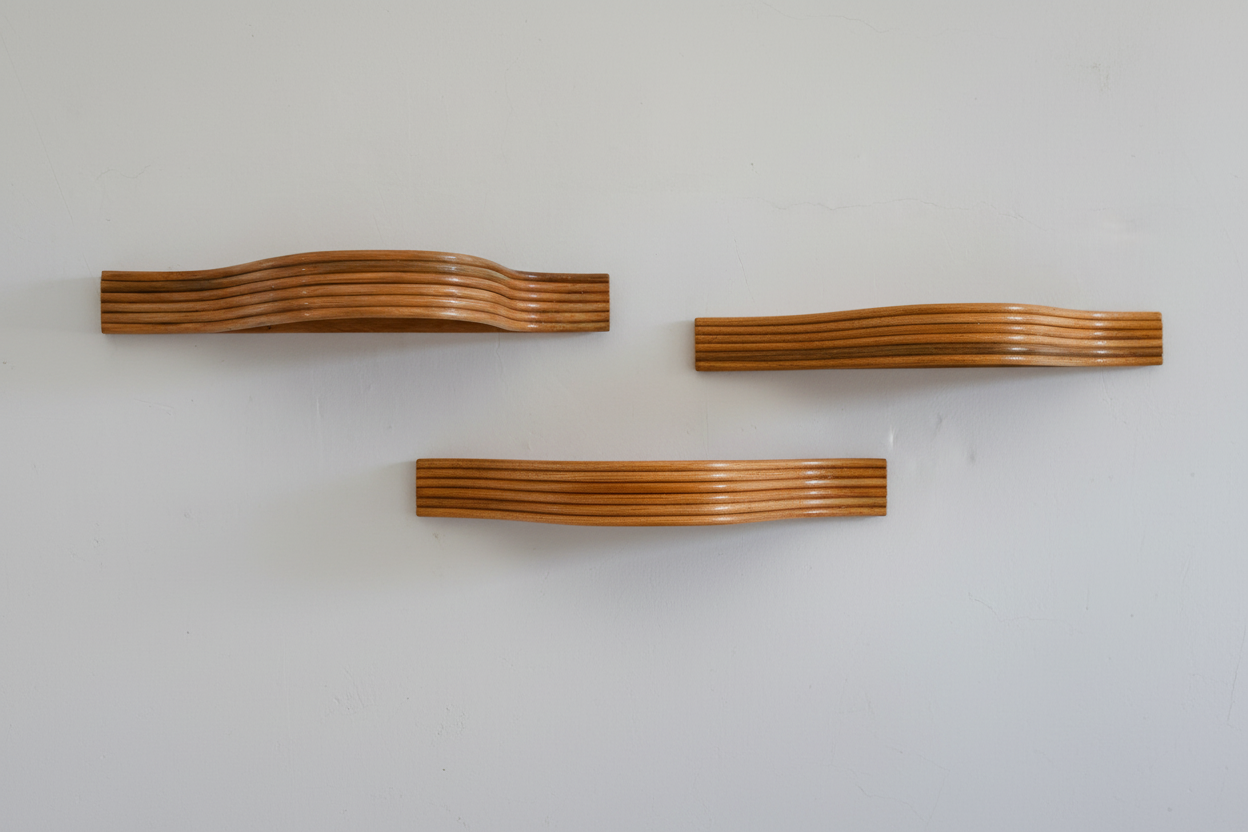 Three curved rattan shelves product photo