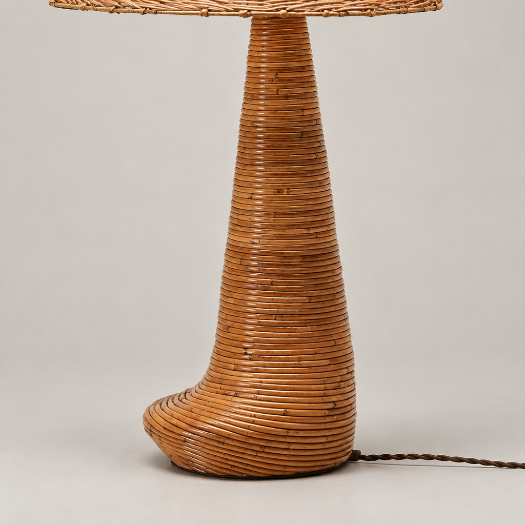Close-up of Chloe’s horizontally wrapped rattan base with a curved, flared foot.